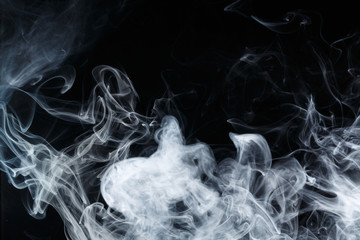 Abstract smoke Weipa. Personal vaporizers fragrant steam. The concept of alternative non-nicotine smoking. Blue smoke on a black background. E-cigarette. Evaporator. Taking Close-up. Vaping.