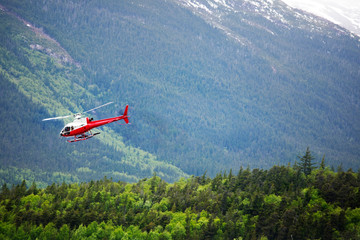 Fototapeta na wymiar Wilderness helicopter flying out from Skagway, Alaska
