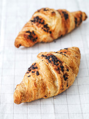 Delicious breakfast with fresh flaky croissants, close up on the croissants