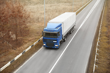 Truck on road. Delivery and shipping concept.