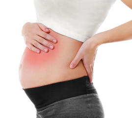 Pregnant woman with abdominal pain on white background