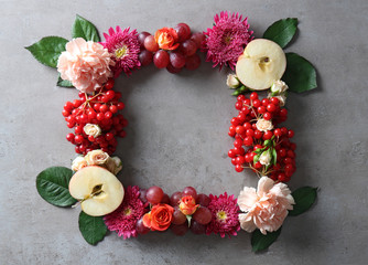 Beautiful flowers wreath on grey textured background