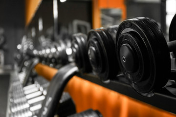 Fototapeta na wymiar Closeup of dumbbells in gym