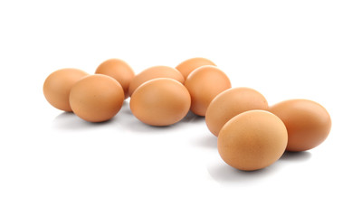Brown eggs isolated on white