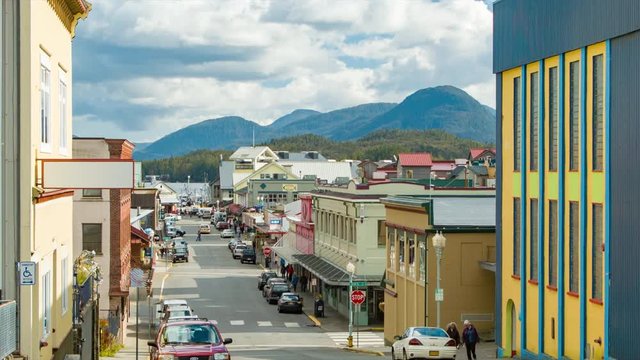 Ketchikan Alaska View Down Main Street with Shops and Retail Storefronts and Mountains Background