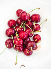 Cherry. Cherries in white plate. Red cherry. Fresh cherries. Cherry on white background. Cherries isolated on white.
