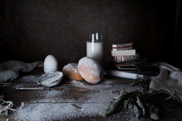still life, vintage. a simple country breakfast. milk, eggs, white bread, flour on  wooden table....