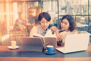 Asian woman drinking coffee in vintasg color tone