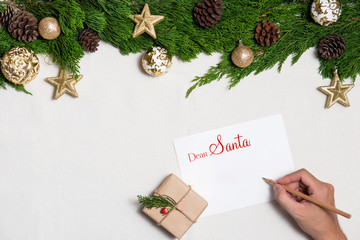 Hand writting Christmas Card on Xmas background. Top view.