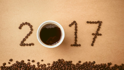 2017 coffee bean text on red craft paper for new year concept background

