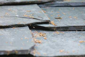 Closeup of dark grey stone roof tiles