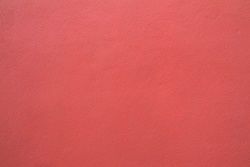 Fototapeta premium red pink wall background from cement