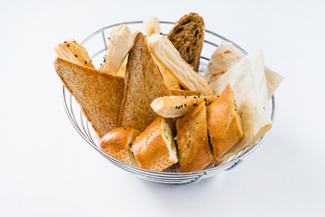 Basket with different kinds of fresh bread