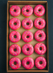 Pink donuts in takeaway box