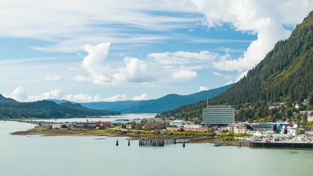 City of Juneau Alaska on the Gastineau Channel in the Alaskan Panhandle with an Epic Cloudy Blue Sky