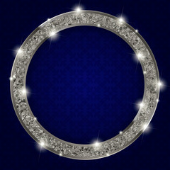 round silver frame with lights on dark background