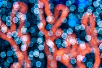 Abstract circular bokeh background against dark background