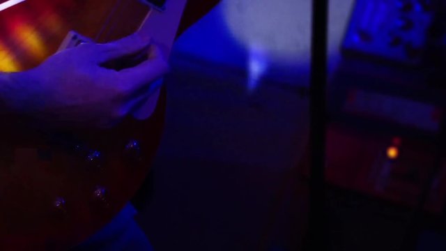 Fragment solo guitar and hand closeup