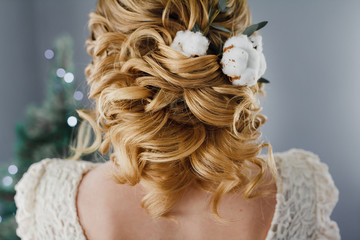 beauty wedding hairstyle decorated with cotton flower, rear view