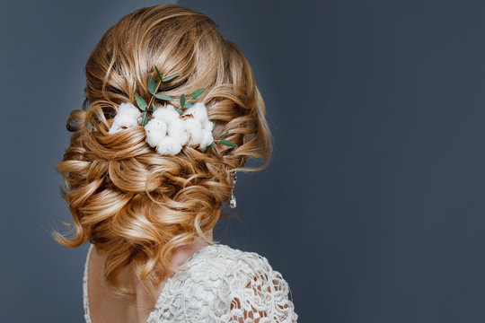 beauty wedding hairstyle decorated with cotton flower, rear view