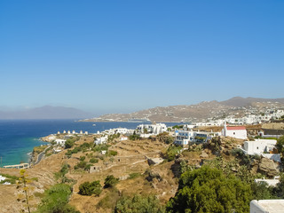 Fototapeta na wymiar View of Mykonos port with boats and famous windmills