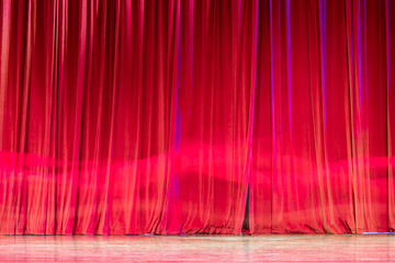Red curtain and motion in the theatre.