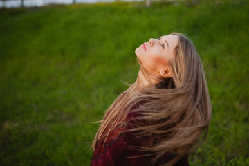 Fototapeta premium Pretty blonde girl with a beautiful long