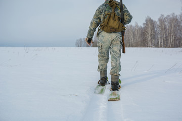Fototapeta na wymiar The hunter shoots winter