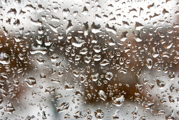 Image of rain drops on glass close-up.