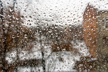Image of rain drops on glass close-up.