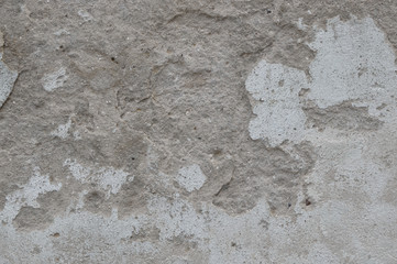 Old wall with cracks and peeling paint, texture background