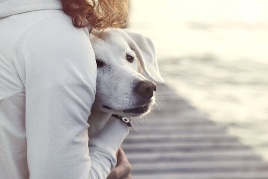 woman and her dog together outdoors