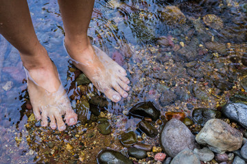 Feet  soak in water stream