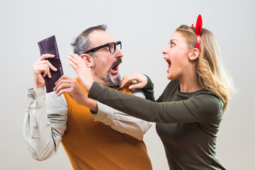 Nerdy man is trying to hide money from his wife because she want to spend it all.
