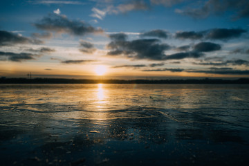 Frozen lake by sunset closeup