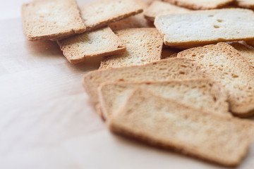 Selective focused shot of crackers on wooden table, a sort of biscuit , brown cracker made from flour