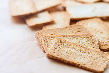 Selective focused shot of crackers on wooden table, a sort of biscuit , brown cracker made from flour