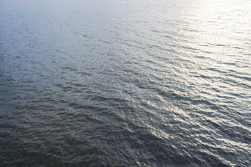 water waves in river in sunset