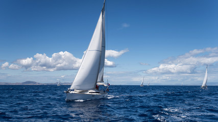 Obraz premium Yachting regatta in the Mediterranean sea near the Syros island