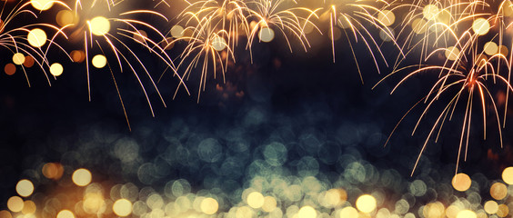 Gold and dark blue Fireworks and bokeh in New Year eve and copy space. Abstract background holiday. - Powered by Adobe
