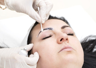 Fototapeta na wymiar Mikrobleyding eyebrows workflow in a beauty salon
