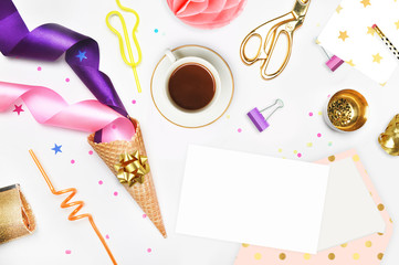 Glamour style background, flat lay. Gold and party items: Cocktail tubes apple, pear, spiral, ice cream cone, gold cosmetic bag, golden pineapple, stapler, scissors, paste. Desktop. view table, up.