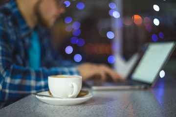 view on coffie with working man  background