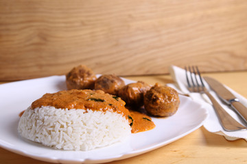 Rice with meatballs and sauce, an excellent dinner, homemade food 