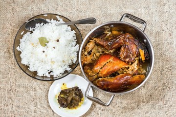 Rabbit, rice, liver in pot on jute