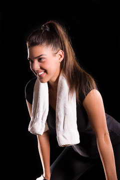 young  sport woman posing with towel  with fit slim body isolate