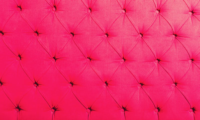 pink textile with buttons