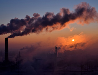 Smoking chimneys at sunrise