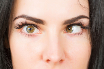 crazy female eyes with strabismus - obrazy, fototapety, plakaty