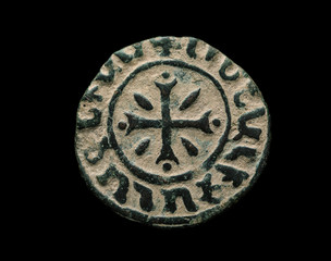 Ancient copper armenian coin isolated on black